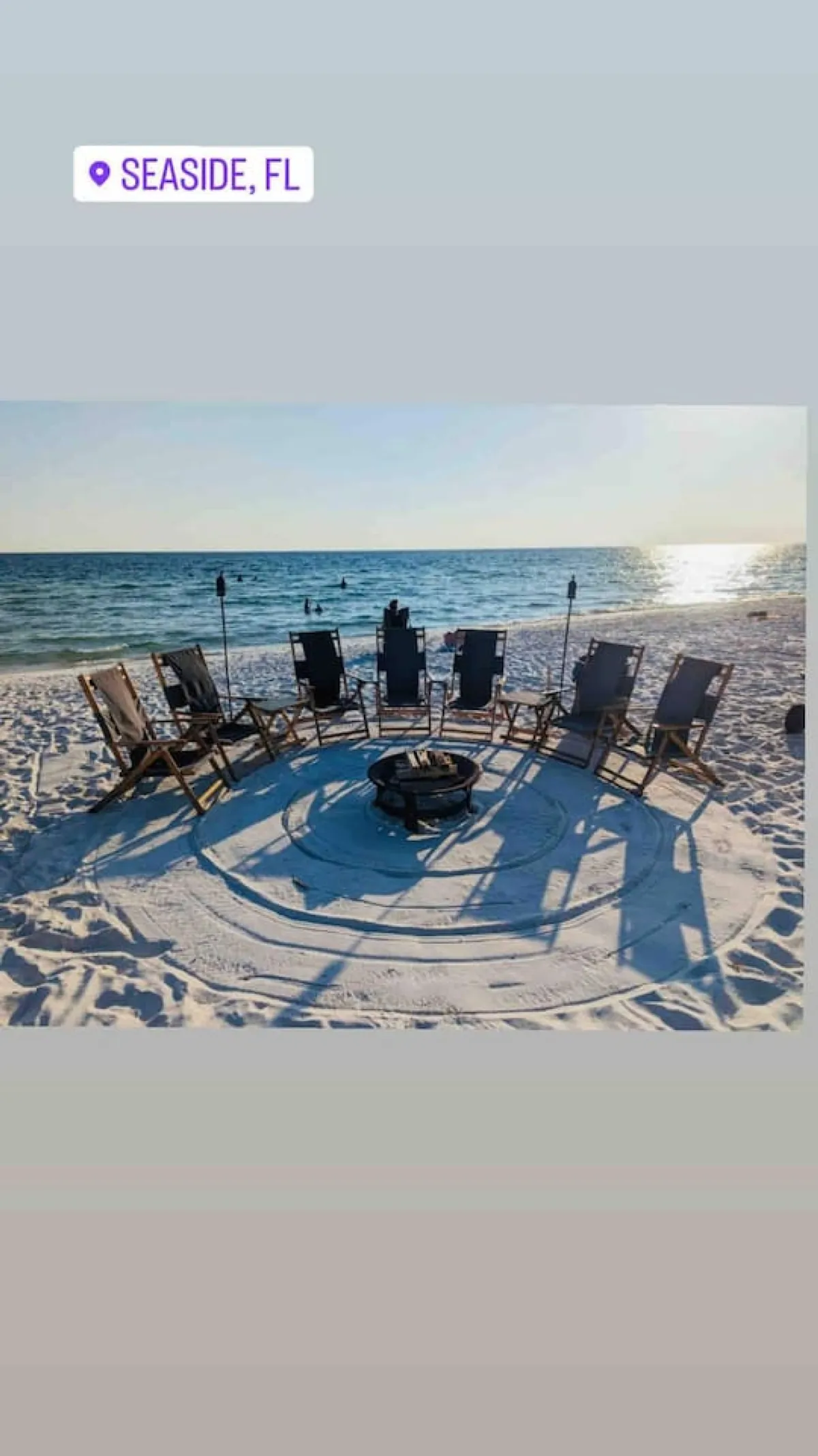 A circle of beach chairs surrounds a fire pit overlooking the ocean, suggesting communal gatherings under the open sky. The backdrop features a stunning ocean view, with the warm ambiance perfect for sunset moments and evening relaxation.